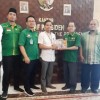 Pemuda PUI berfoto bersama dengan KSP, Eko Sulistiyo usai pertemauan.