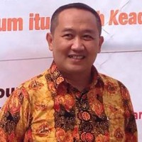 Dr. Haris Budiman, SH, MH